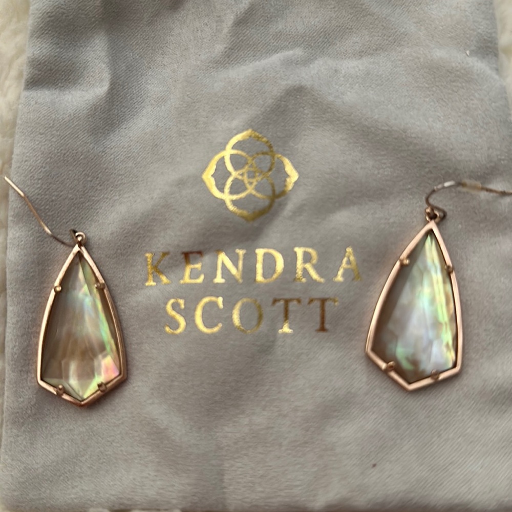 Kendra Scott gold earrings with gold iridescent stone